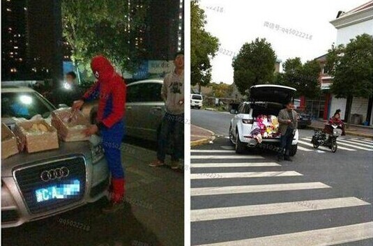 奥迪Q5，车主穿成蜘蛛人，不知是怕人认出来还是怕自己的豪车不够抢眼为了吸引眼球。